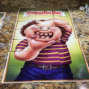Set of  21 Garbage Pail Kids trading  cards that are complete to make puzzle.